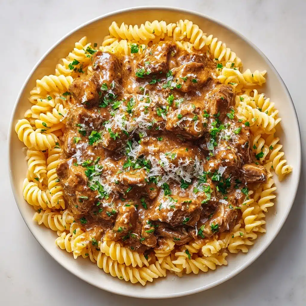 Slow Cooker Creamy Garlic Beef Pasta Recipe - Recipe Image