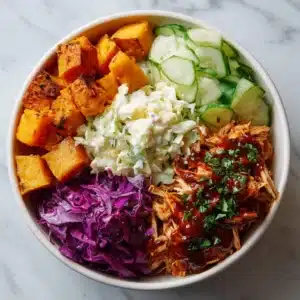 BBQ Chicken Bowls with Sweet Potatoes, Coleslaw, and Pickles Recipe