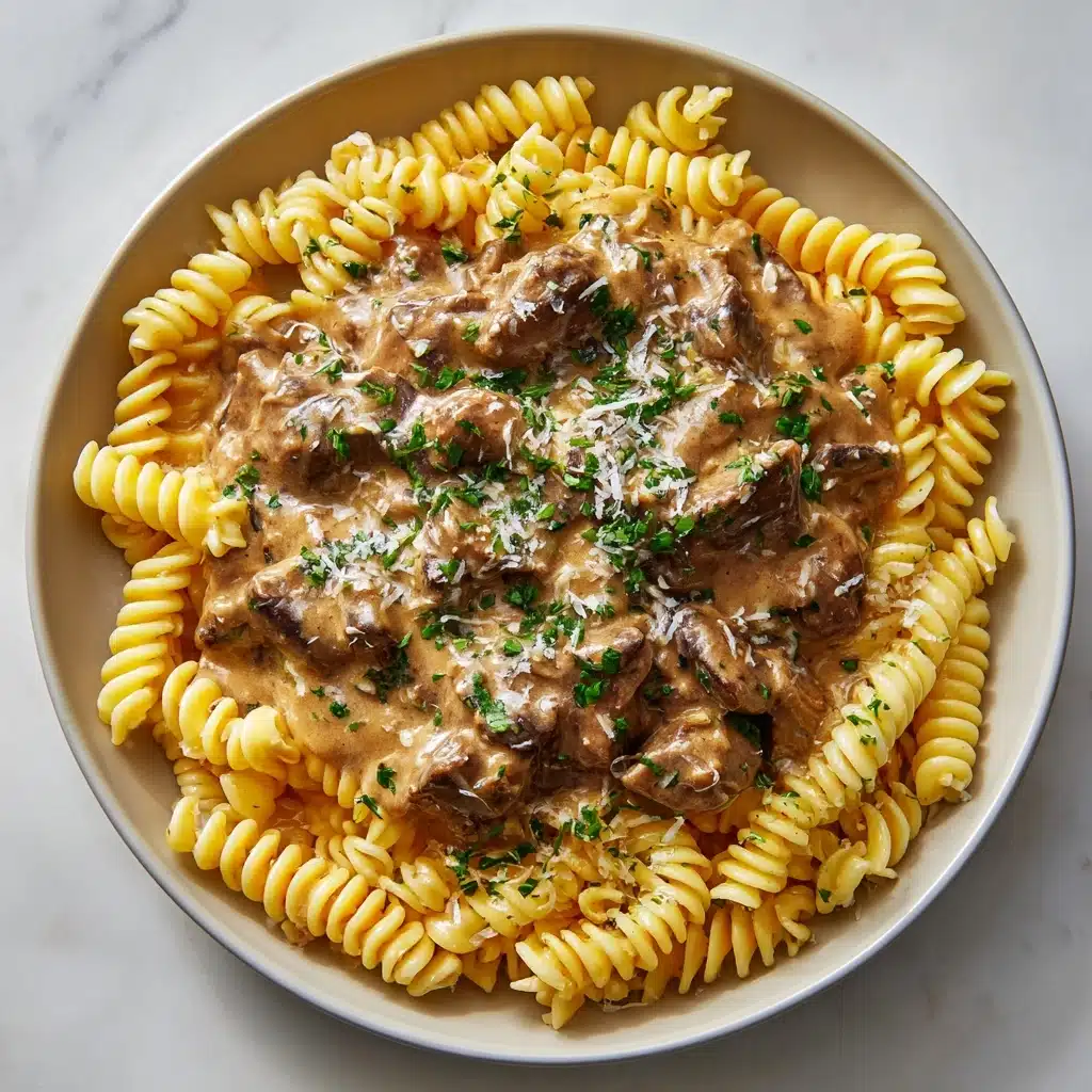 Slow Cooker Creamy Garlic Beef Pasta Recipe - Recipe Image