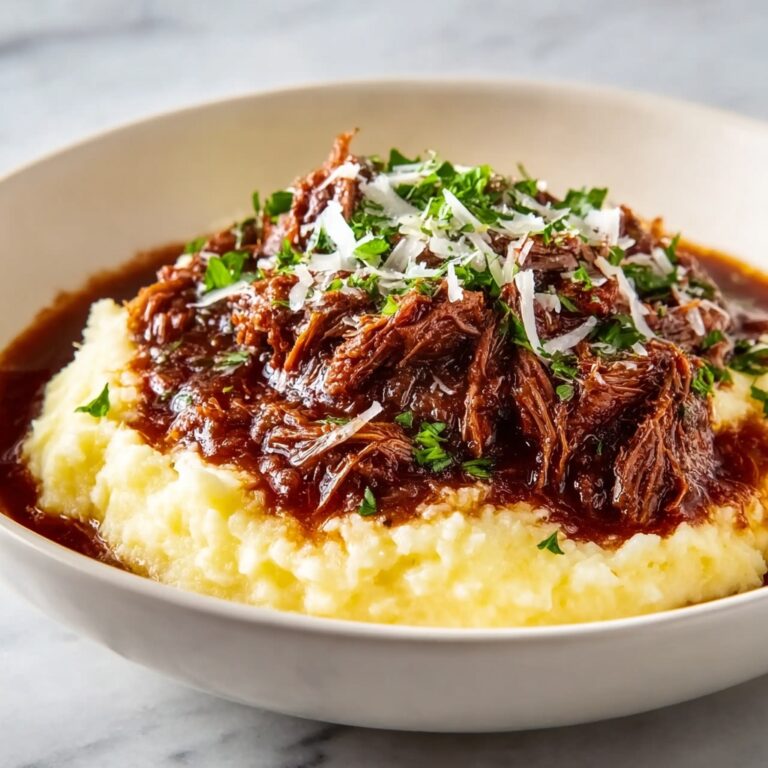 Tender Short Rib Ragu Over Silky Parmesan Mashed Potatoes Recipe